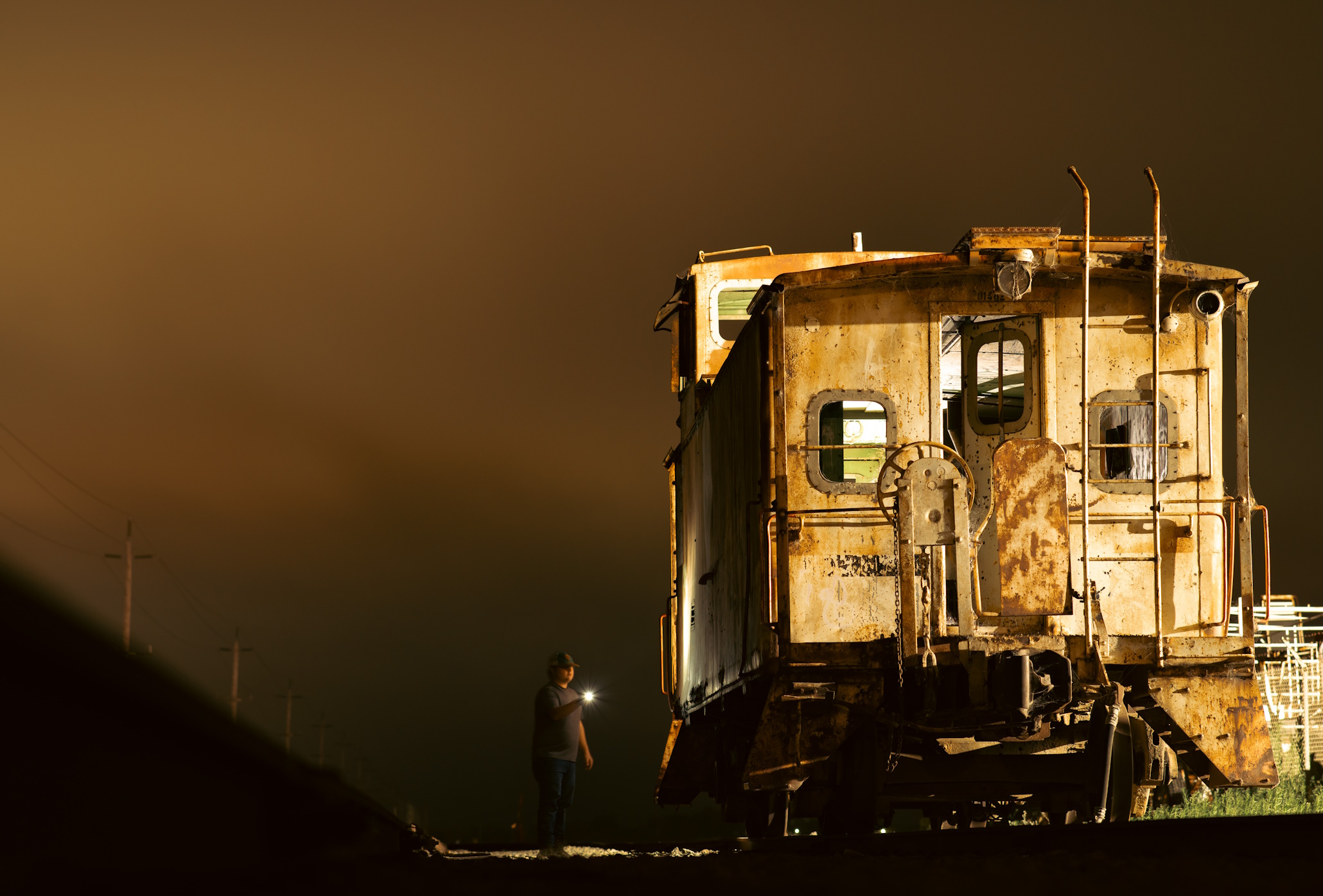 Caboose at Night with inspection worker